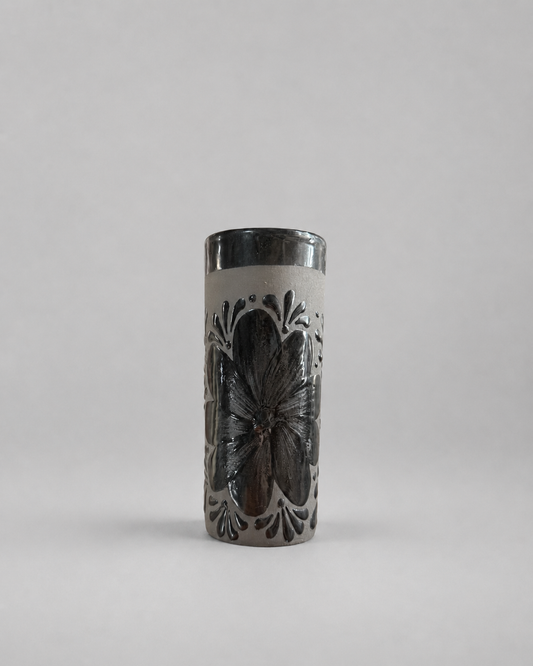 Tall cylindrical cup with butterfly design on a gray background