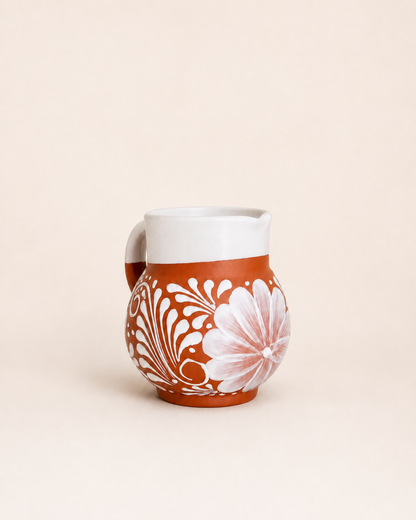 Ceramic mug with floral pattern on a beige background