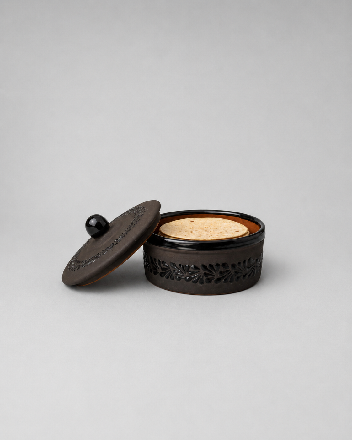 Black decorative container with a  light gray background
