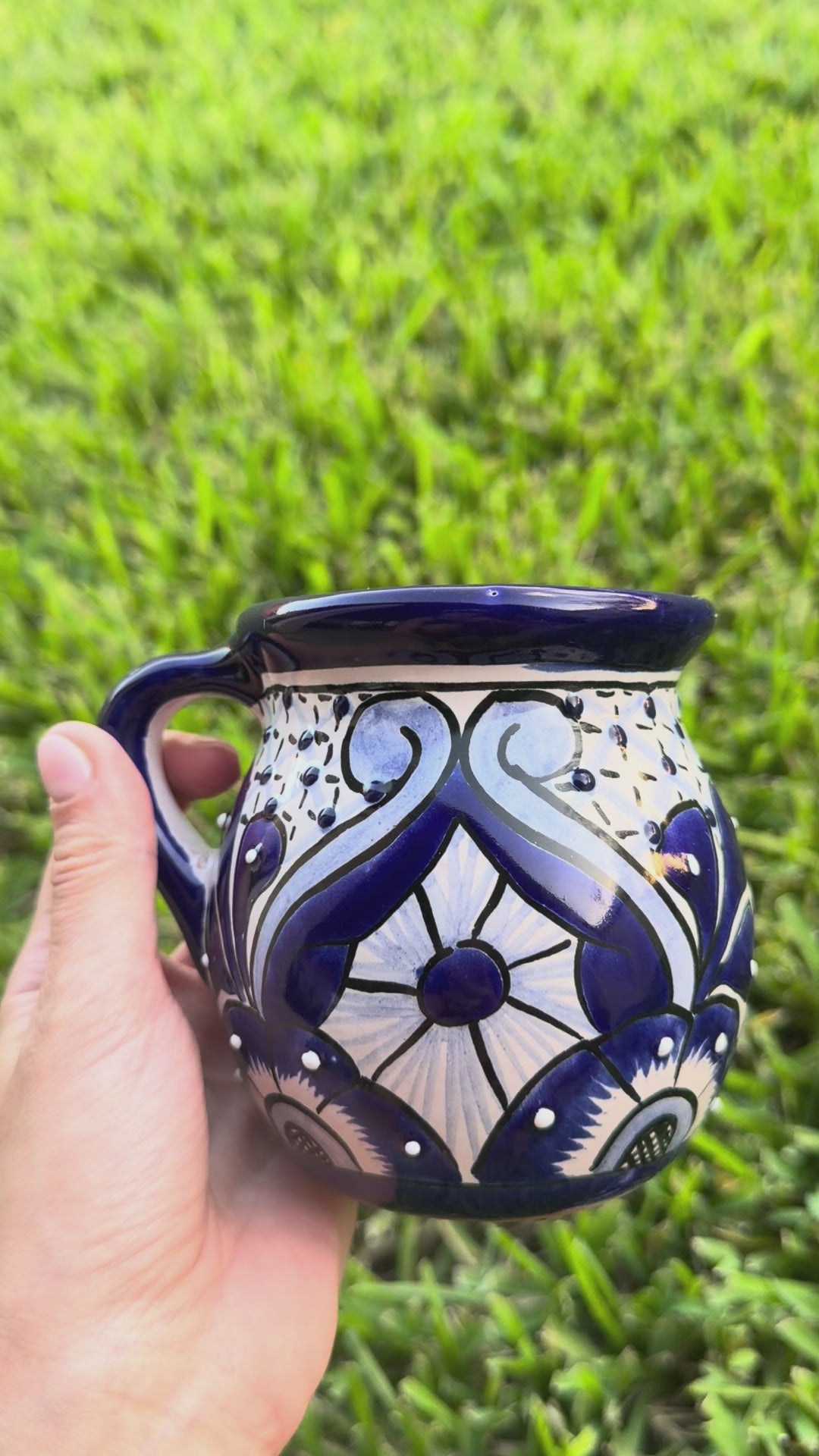 Video of 2 blue and white talavera mugs.