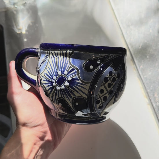 VIdeo of a blue and white talavera round mug